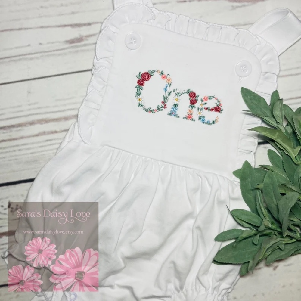Embroidered “one” floral sunsuit size 12m (never worn, got lost in mail)